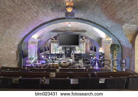 Restaurant interior view from tiered seats for big screen spectators View Large Photo Image Stock Image - Restaurant interior view from tiered seats for big screen spectators. Fotosearch