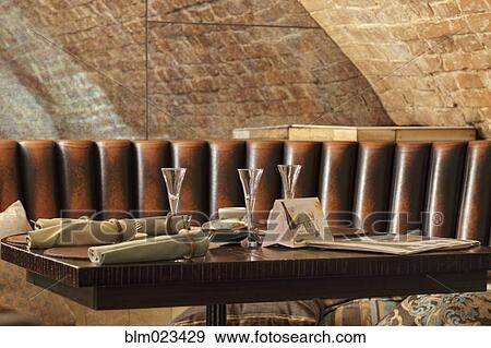 Restaurant leather lounge with three glasses on table View Large Photo Image Stock Photo - Restaurant leather lounge with three glasses on table. Fotosearch