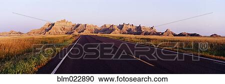 Stock Image - Road in Badlands National Park. Fotosearch