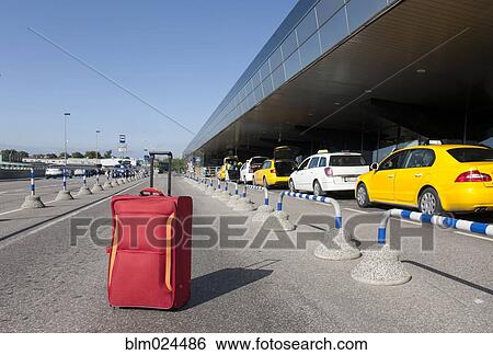 Rolling Luggage Outside an Airport Terminal View Large Photo Image Stock Photograph - Rolling Luggage Outside an Airport Terminal. Fotosearch