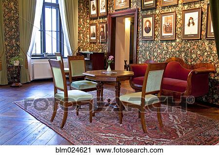 Stock Image - Room With Framed Portraits. Fotosearch
