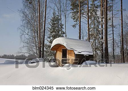 Stock Photography - Round Barrel Sauna in the Snow. Fotosearch