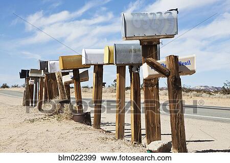 Row Of Mailboxes Along Desert Road View Large Photo Image Stock Photo - Row Of Mailboxes Along Desert Road. Fotosearch