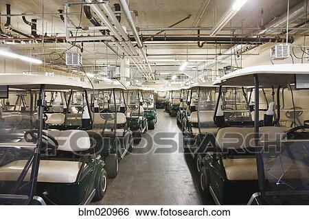 Rows of Golf Carts in a Warehouse View Large Photo Image Stock Photograph - Rows of Golf Carts in a Warehouse. Fotosearch