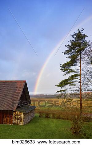 Rural scene, a rainbow in the sky, after rain View Large Photo Image Stock Image - Rural scene, a rainbow in the sky, after rain. Fotosearch