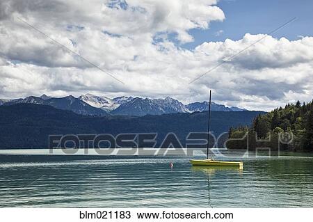 Stock Image - Sailboat Moored in Lake. Fotosearch