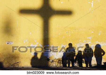 Stock Photo - Shadow of Cross and People. Fotosearch