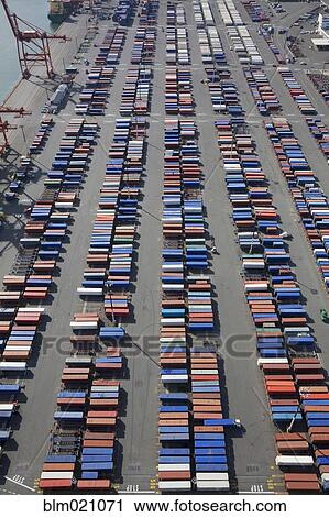 Stock Image - Shipping Containers To Be Loaded Onto Semi Trucks. Fotosearch