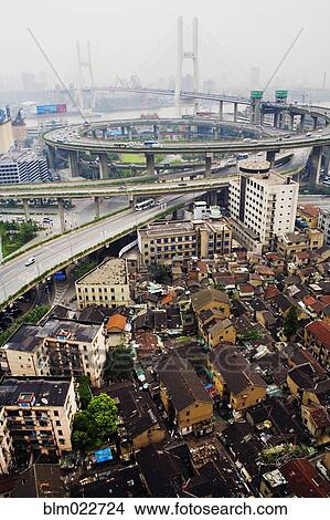 Slum Housing with Nanpu Bridge in Background View Large Photo Image Picture - Slum Housing with Nanpu Bridge in Background. Fotosearch
