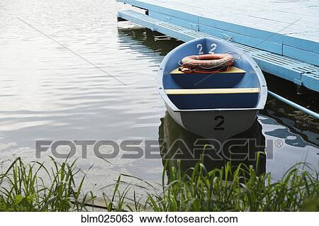 Stock Image - Small Moored Boat. Fotosearch