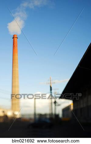 Stock Image - Smokestack and Factory. Fotosearch