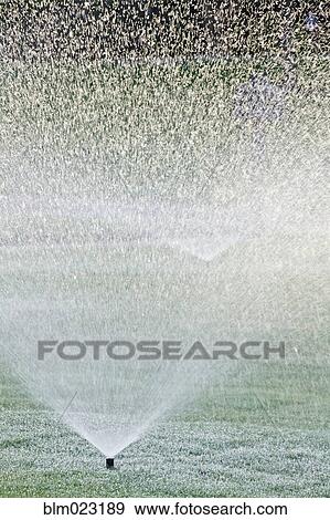 Sprinklers on Lawn View Large Photo Image Stock Photo - Sprinklers on Lawn. Fotosearch