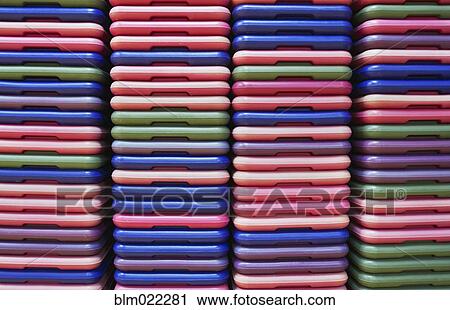 Stack of colorful plastic step mats for step class in a recreation center View Large Photo Image Stock Image - Stack of colorful plastic step mats for step class in a recreation center. Fotosearch