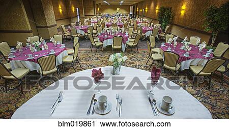Stock Image - Table and Chairs in Hotel Dining Room. Fotosearch