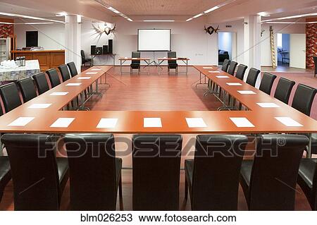Tables and chairs arranged for a presentation, with a whiteboard View Large Photo Image Stock Image - Tables and chairs arranged for a presentation, with a whiteboard. Fotosearch
