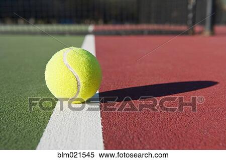 Stock Photography - Tennis Ball Sitting on Court. Fotosearch