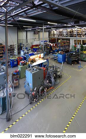 The factory floor of an industrial coiled spring factory View Large Photo Image Stock Image - The factory floor of an industrial coiled spring factory. Fotosearch