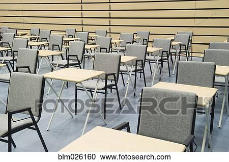 The Main Hall Of A Modern Secondary School Set Out For Exams With