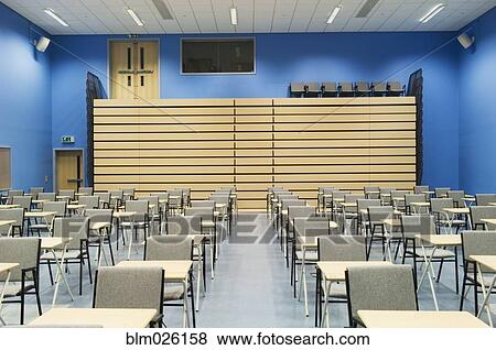 The Main Hall Of A Modern Secondary School Set Out For Exams With