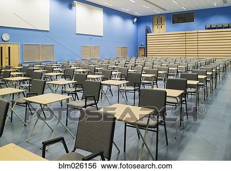 The Main Hall Of A Modern Secondary School Set Out For Exams With