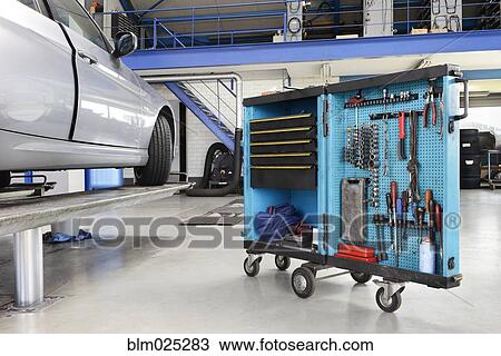 Tool cart in a car repair workshop or garage View Large Photo Image Stock Image - Tool cart in a car repair workshop or garage. Fotosearch