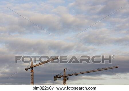 Tower Cranes and Clouds View Large Photo Image Stock Photo - Tower Cranes and Clouds. Fotosearch
