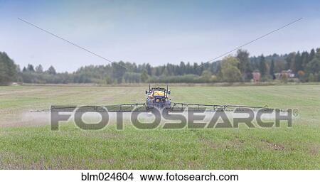 Tractor Spraying Herbicide View Large Photo Image Picture - Tractor Spraying Herbicide. Fotosearch