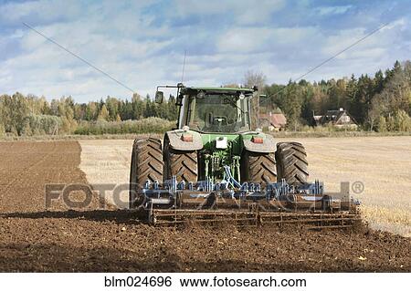 Tractor With an Aerator View Large Photo Image Stock Photograph - Tractor With an Aerator. Fotosearch