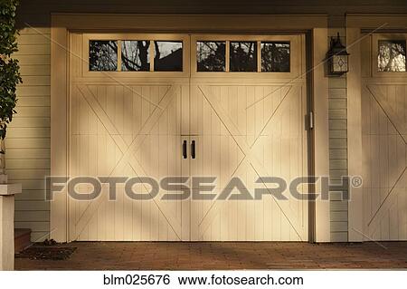 Traditional residential home and double car garage View Large Photo Image Stock Photograph - Traditional residential home and double car garage. Fotosearch