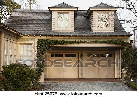 Traditional residential home and double car garage View Large Photo Image Stock Photography - Traditional residential home and double car garage. Fotosearch