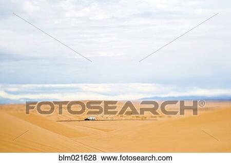 Stock Photo - Truck Driving Through Desert. Fotosearch