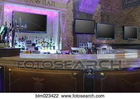 TV screens in a row against bar stand View Large Photo Image Stock Image - TV screens in a row against bar stand. Fotosearch