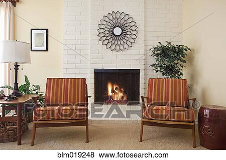 Stock Photo - Two Chairs Next To Fireplace. Fotosearch