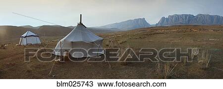 Two traditional yurts on a flat plain View Large Photo Image Stock Image - Two traditional yurts on a flat plain. Fotosearch