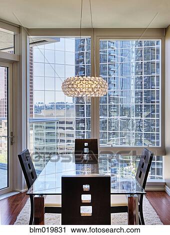 Stock Image - Upscale Dining Area in High Rise Condo. Fotosearch