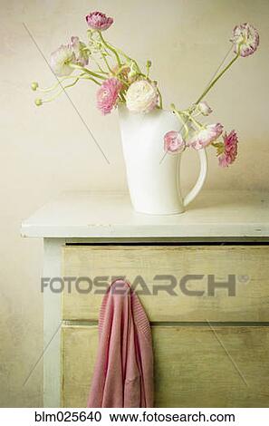 Vase of flowers and sweater on knob of dresser drawer View Large Photo Image Stock Image - Vase of flowers and sweater on knob of dresser drawer. Fotosearch