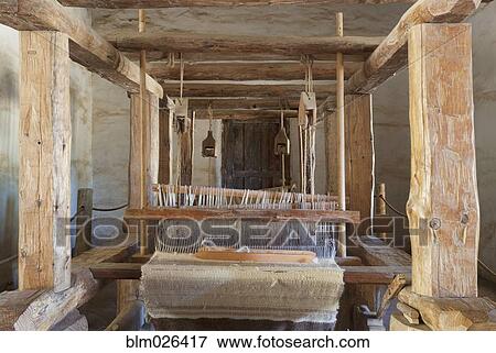 Weaving cloth on antique wooden loom View Large Photo Image Stock Photo - Weaving cloth on antique wooden loom. Fotosearch