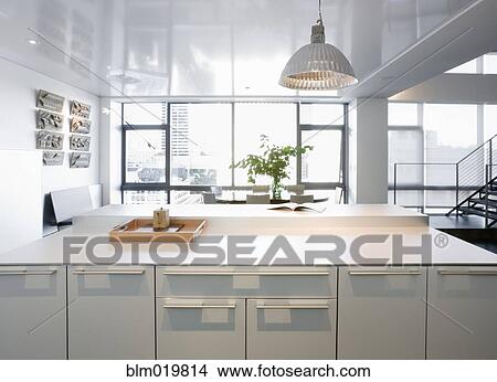White Counters and Dining Area View Large Photo Image Picture - White Counters and Dining Area. Fotosearch