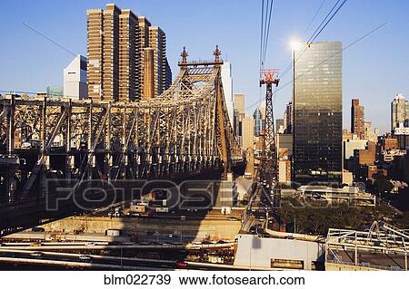 Stock Photo - Williamsburg Bridge with Skyscrapers in Background. Fotosearch