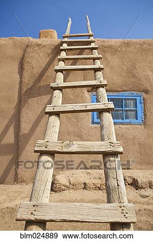 Wooden Ladder Against an Adobe Building View Large Photo Image Stock Photo - Wooden Ladder Against an Adobe Building. Fotosearch