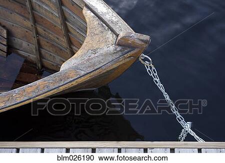 Wooden rowing boats moored View Large Photo Image Stock Image - Wooden rowing boats moored . Fotosearch