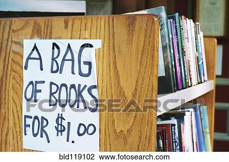 A bag of books for $1. 00 sign in library View Large Photo Image Stock Image - A bag of books for $1. 00 sign in library. Fotosearch