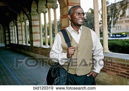 Stock Photo - African American professor smiling on campus. Fotosearch
