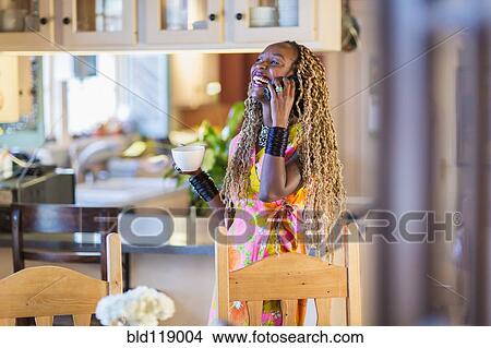 African American woman talking on cell phone View Large Photo Image Picture - African American woman talking on cell phone. Fotosearch