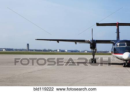 Airplane taxiing on runway View Large Photo Image Stock Image - Airplane taxiing on runway. Fotosearch