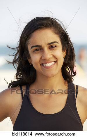 Asian woman smiling on beach View Large Photo Image Picture - Asian woman smiling on beach. Fotosearch