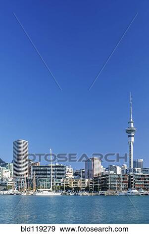 Stock Photo - Auckland skyline on waterfront, Auckland, New Zealand. Fotosearch