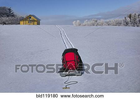 Backpack on wagon making tire tracks in snowy landscape View Large Photo Image Stock Image - Backpack on wagon making tire tracks in snowy landscape. Fotosearch