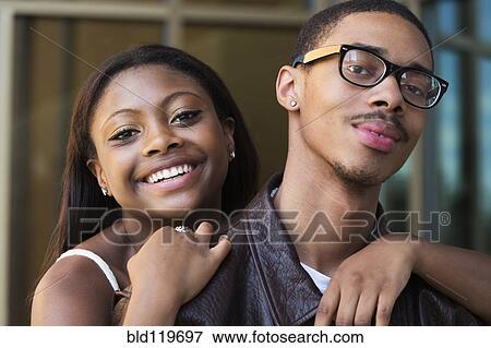 Stock Photo - Black couple smiling outdoors. Fotosearch