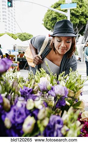 Black woman looking at flowers View Large Photo Image Stock Photography - Black woman looking at flowers. Fotosearch